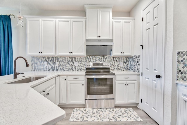 1147 Wildmeadow Run, Winter Park, FL 32792 - kitchen with stainless steel range with electric stovetop, a sink, and backsplash