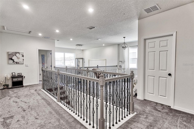 1147 Wildmeadow Run, Winter Park, FL 32792 - corridor featuring carpet flooring, recessed lighting, baseboards, an upstairs landing, and a textured ceiling