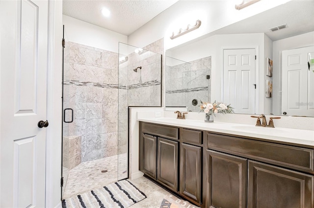 1147 Wildmeadow Run, Winter Park, FL 32792 - bathroom with a shower stall, double vanity, and a textured ceiling