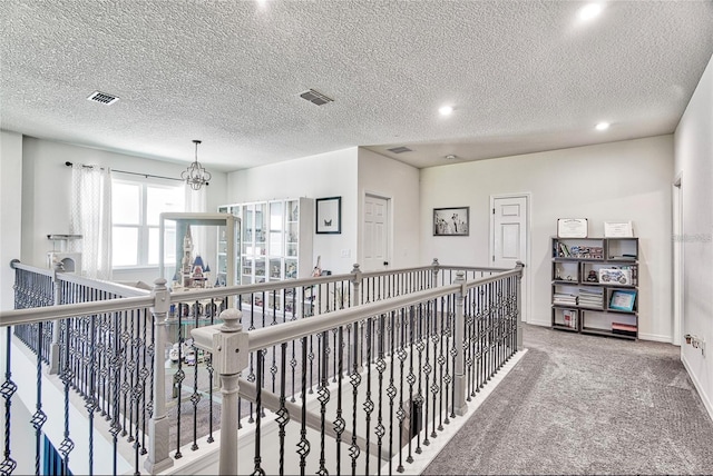 1147 Wildmeadow Run, Winter Park, FL 32792 - hall featuring an upstairs landing, a textured ceiling, carpet flooring, recessed lighting, and baseboards