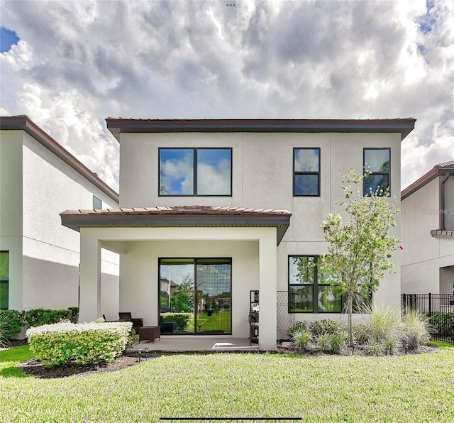 1147 Wildmeadow Run, Winter Park, FL 32792 - back of property featuring stucco siding and a patio