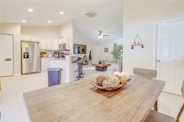 15303 SW 52nd Cir, Ocala, FL 34473 - dining space featuring ceiling fan, lofted ceiling, light tile patterned flooring, and recessed lighting