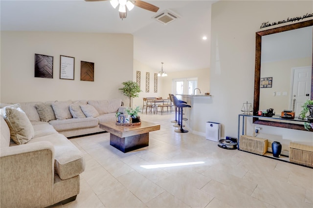 15303 SW 52nd Cir, Ocala, FL 34473 - living area featuring vaulted ceiling, ceiling fan, and a chandelier