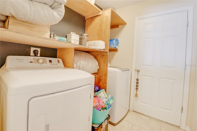 15303 SW 52nd Cir, Ocala, FL 34473 - washroom with washing machine and clothes dryer and light tile patterned flooring