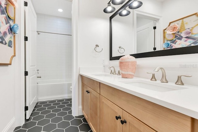 13791 Abberwick Dr, Orlando, FL 32832 - bathroom with double vanity, toilet, tile patterned floors, shower / washtub combination, and recessed lighting