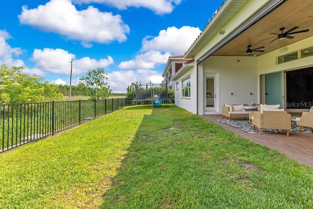13791 Abberwick Dr, Orlando, FL 32832 - view of yard featuring a trampoline, outdoor lounge area, a ceiling fan, and a patio