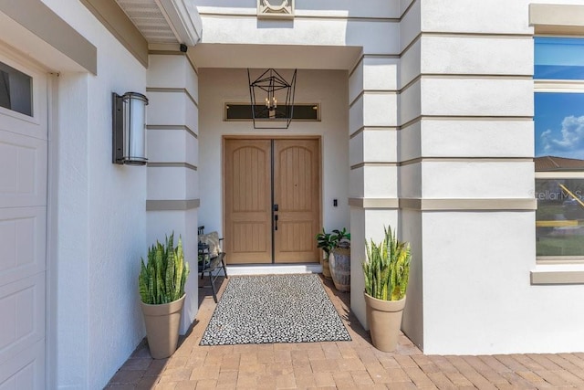 13791 Abberwick Dr, Orlando, FL 32832 - doorway to property featuring stucco siding