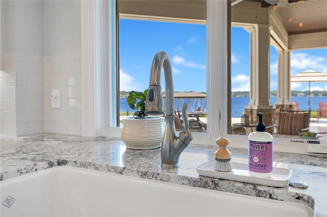 10845 Bayshore Dr, Windermere, FL 34786 - kitchen view of a sink and light stone counters