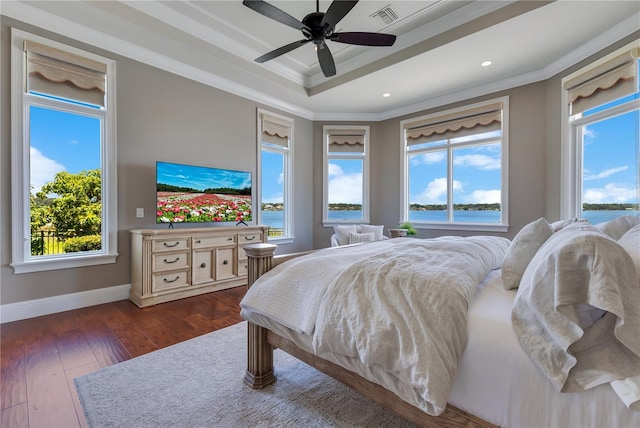 10845 Bayshore Dr, Windermere, FL 34786 - bedroom with ornamental molding, a tray ceiling, dark wood-style flooring, baseboards, and recessed lighting