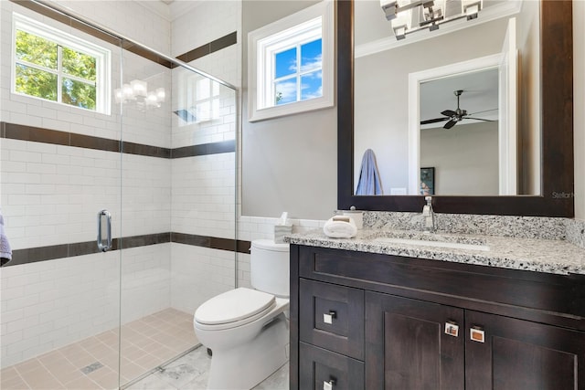 10845 Bayshore Dr, Windermere, FL 34786 - bathroom with toilet, vanity, a shower stall, ceiling fan, and crown molding
