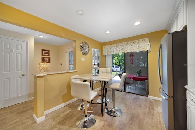 1074 Kensington Park Ct Unit 101, Altamonte Springs, FL 32714 - kitchen with freestanding refrigerator, light wood-style floors, baseboards, and recessed lighting