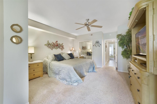 1074 Kensington Park Ct Unit 101, Altamonte Springs, FL 32714 - bedroom with light colored carpet, ceiling fan, and baseboards