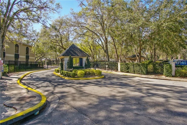 1074 Kensington Park Ct Unit 101, Altamonte Springs, FL 32714 - view of asphalt street featuring curbs, sidewalks, and a gated entry