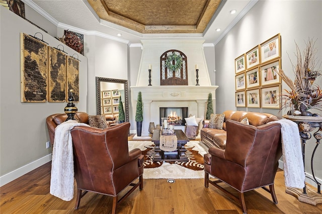 190 Osprey Hammock Trl, Sanford, FL 32771 - living room with a raised ceiling, hardwood / wood-style floors, a large fireplace, baseboards, and ornamental molding