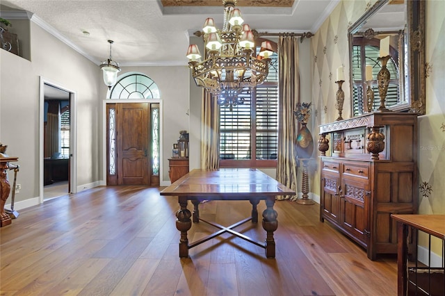 190 Osprey Hammock Trl, Sanford, FL 32771 - dining area with hardwood / wood-style floors, a chandelier, crown molding, baseboards, and a textured ceiling