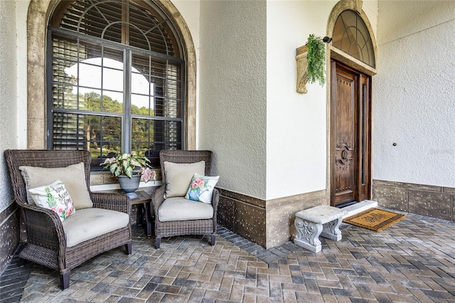 190 Osprey Hammock Trl, Sanford, FL 32771 - doorway to property featuring stucco siding and covered porch