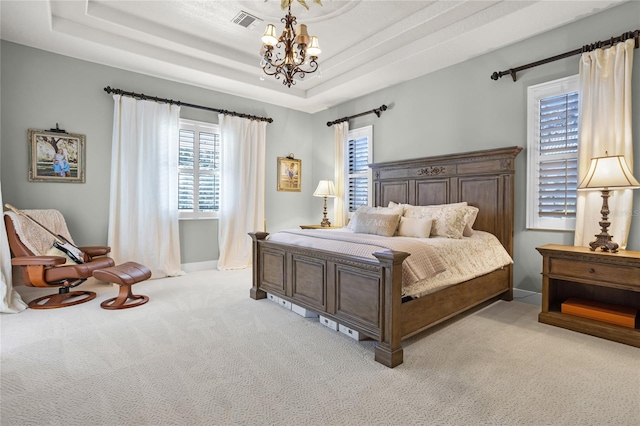 190 Osprey Hammock Trl, Sanford, FL 32771 - bedroom with a chandelier, light carpet, multiple windows, and a tray ceiling