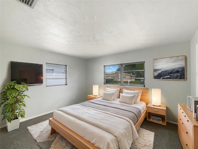 300 Ave E SE, Winter Haven, FL 33880 - carpeted bedroom with multiple windows and baseboards