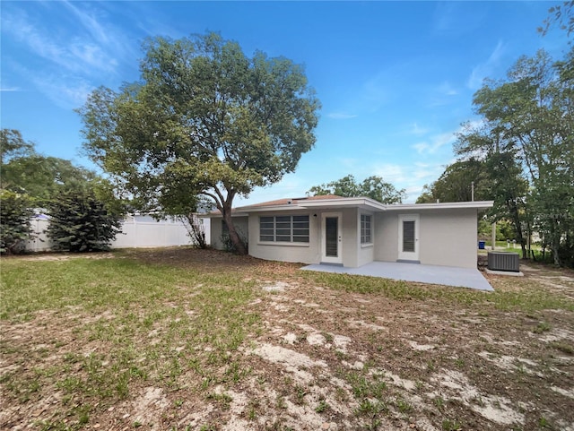 300 Ave E SE, Winter Haven, FL 33880 - rear view of house featuring a patio area, stucco siding, and cooling unit
