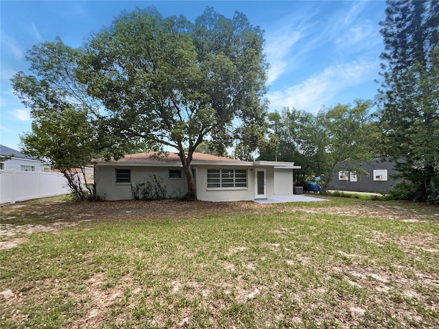 300 Ave E SE, Winter Haven, FL 33880 - rear view of property featuring stucco siding and a patio area