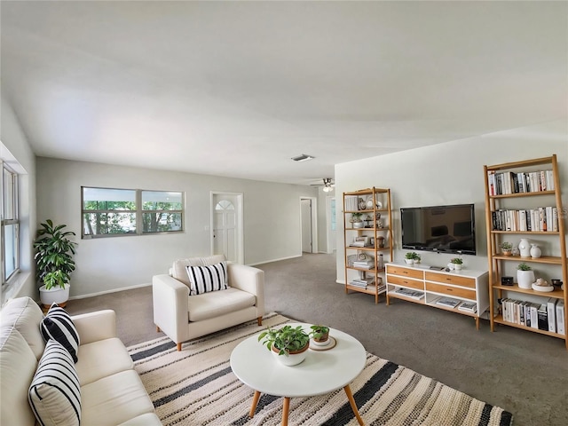 300 Ave E SE, Winter Haven, FL 33880 - carpeted living room featuring baseboards