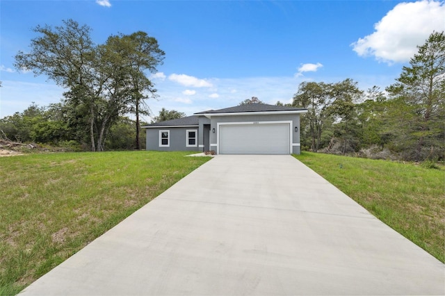 16904 SW 30th Avenue Rd, Ocala, FL 34473 - view of front of property featuring stucco siding, a garage, concrete driveway, and a front yard