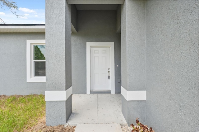 16904 SW 30th Avenue Rd, Ocala, FL 34473 - doorway to property with stucco siding