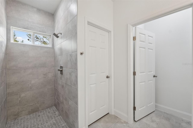 16904 SW 30th Avenue Rd, Ocala, FL 34473 - bathroom with tiled shower, tile patterned floors, and baseboards