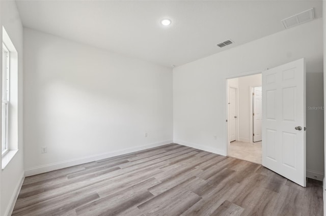 16904 SW 30th Avenue Rd, Ocala, FL 34473 - spare room with wood finished floors, recessed lighting, and baseboards