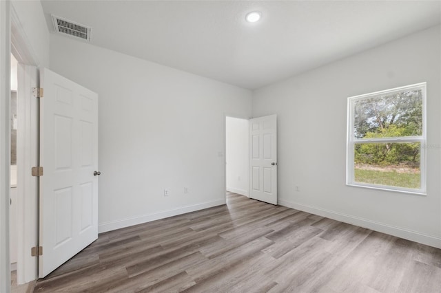 16904 SW 30th Avenue Rd, Ocala, FL 34473 - unfurnished bedroom with light wood-style floors and baseboards