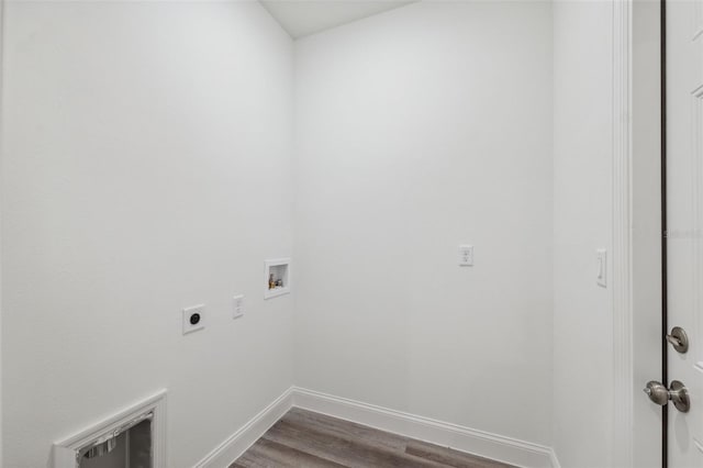 16904 SW 30th Avenue Rd, Ocala, FL 34473 - laundry area with electric dryer hookup, hookup for a washing machine, dark wood-style floors, and baseboards