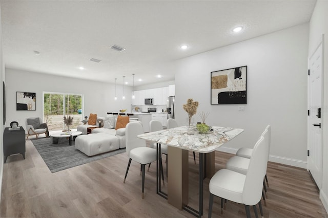 16904 SW 30th Avenue Rd, Ocala, FL 34473 - dining room featuring wood finished floors, recessed lighting, and baseboards