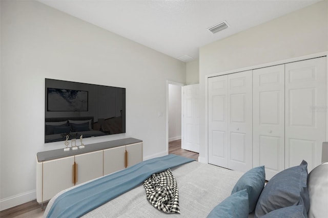 16904 SW 30th Avenue Rd, Ocala, FL 34473 - bedroom featuring wood finished floors, baseboards, and a closet