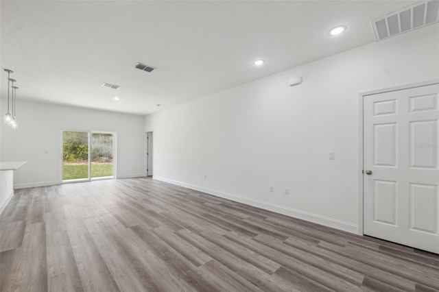 16904 SW 30th Avenue Rd, Ocala, FL 34473 - unfurnished living room featuring wood finished floors, recessed lighting, and baseboards