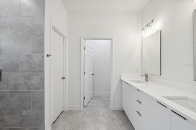 16904 SW 30th Avenue Rd, Ocala, FL 34473 - bathroom featuring double vanity, baseboards, and tile patterned flooring