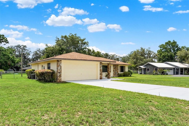 409 Jumper Dr S, Bushnell, FL 33513 - ranch-style home featuring stone siding, an attached garage, concrete driveway, and central AC