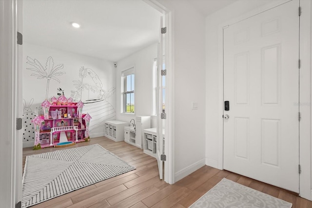 5700 Iron Brand Rd, Saint Cloud, FL 34771 - foyer entrance featuring light wood finished floors, baseboards, and recessed lighting