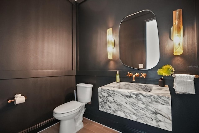 5700 Iron Brand Rd, Saint Cloud, FL 34771 - half bathroom with toilet, wood finished floors, and vanity