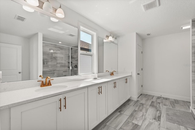 5700 Iron Brand Rd, Saint Cloud, FL 34771 - full bath featuring double vanity, a shower stall, baseboards, and a textured ceiling