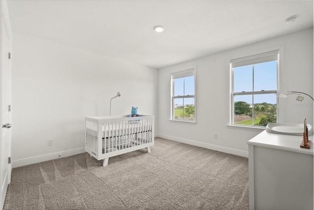 5700 Iron Brand Rd, Saint Cloud, FL 34771 - carpeted bedroom featuring baseboards and a crib
