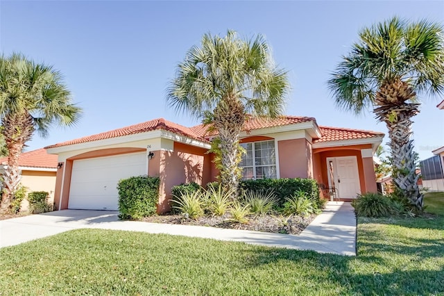 156 Carrera Ave, Davenport, FL 33897 - mediterranean / spanish home with a garage, stucco siding, a front lawn, and concrete driveway