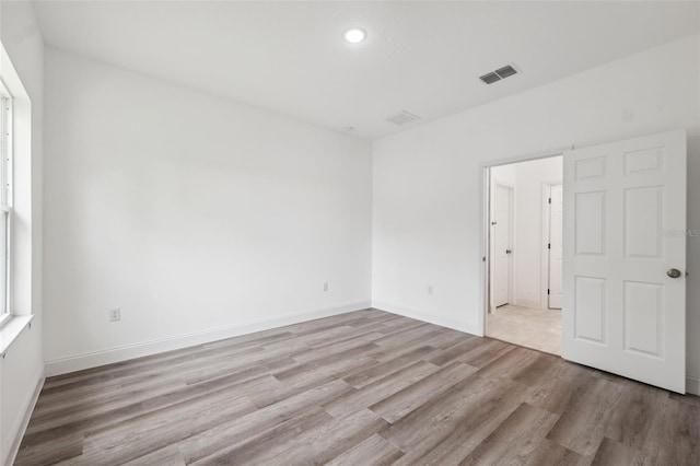 6062 SW 154th Pl, Ocala, FL 34473 - empty room featuring wood finished floors, recessed lighting, and baseboards