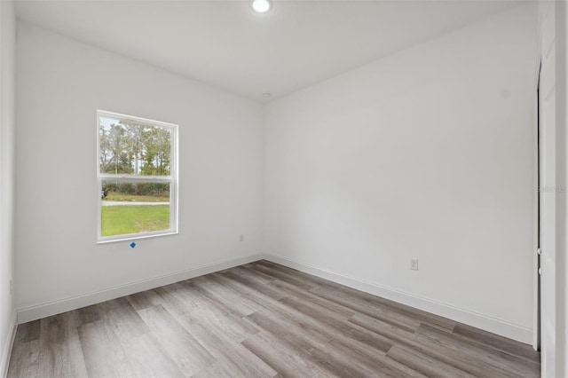6062 SW 154th Pl, Ocala, FL 34473 - empty room with wood finished floors, baseboards, and recessed lighting