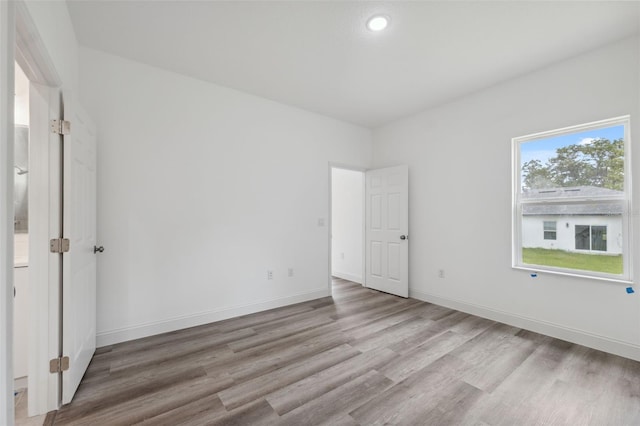 6062 SW 154th Pl, Ocala, FL 34473 - spare room featuring light wood-style flooring, baseboards, and recessed lighting