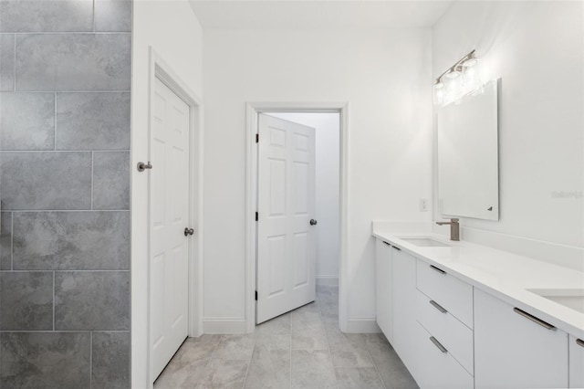 6062 SW 154th Pl, Ocala, FL 34473 - bathroom with double vanity, baseboards, and tile patterned flooring