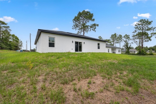 6062 SW 154th Pl, Ocala, FL 34473 - rear view of house featuring stucco siding