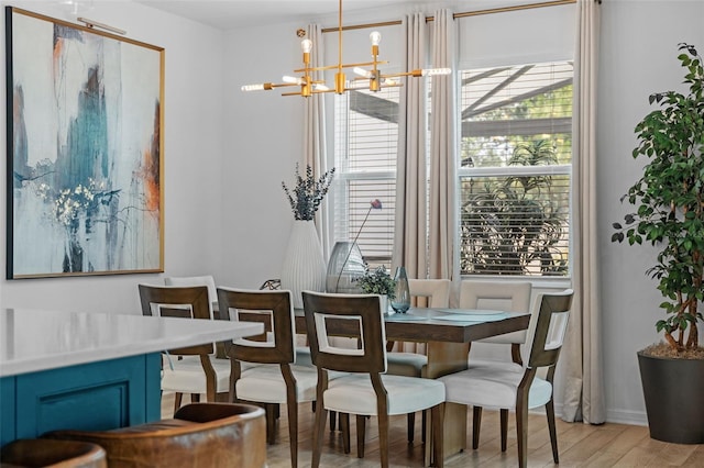 1425 Paget Cv, Sanford, FL 32771 - dining room featuring light wood-style floors, healthy amount of natural light, and a chandelier