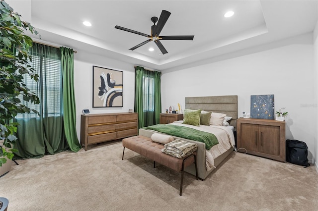 1425 Paget Cv, Sanford, FL 32771 - bedroom featuring light carpet, a tray ceiling, recessed lighting, and a ceiling fan