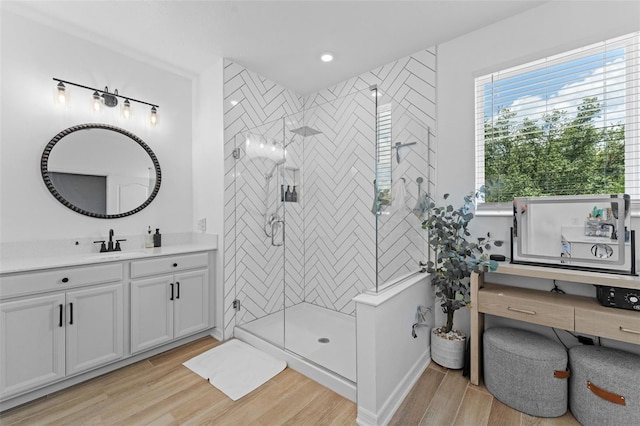 1425 Paget Cv, Sanford, FL 32771 - bathroom featuring vanity, wood finished floors, and a stall shower