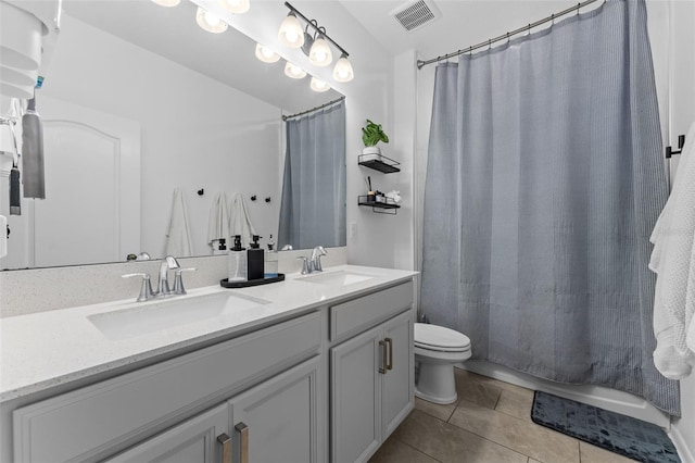 1425 Paget Cv, Sanford, FL 32771 - bathroom with tile patterned floors, toilet, double vanity, and shower / bath combination with curtain
